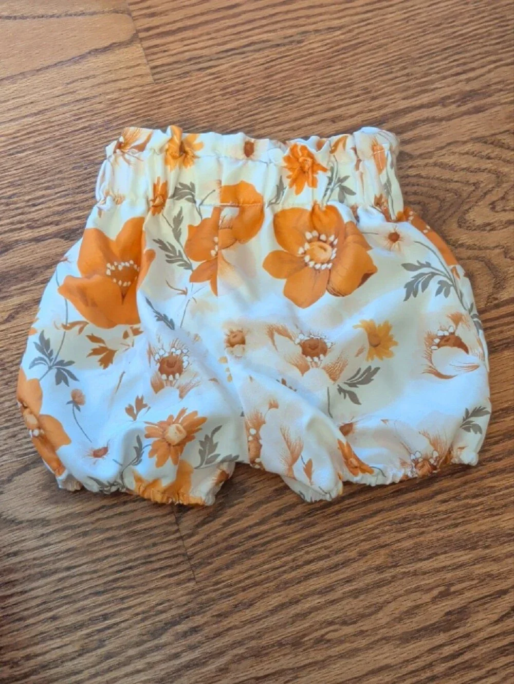 Mustard Orange Graphic Onesie with White & Orange Floral Shorts Set